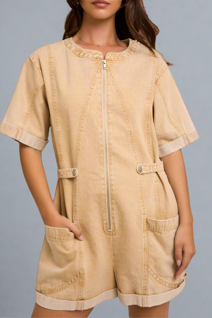 Beige romper worn by a model on a neutral background